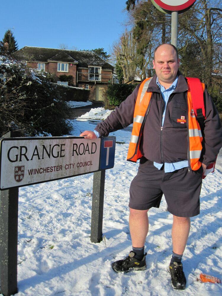 Winchester postman Iain Field delivering his post as normal this week in his regular pair of shorts. By Sandra Showell.