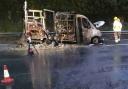 The remains of the burnt out van on the M3