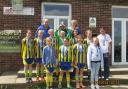 CHAMPS: Romsey Town Youth girls under-12s celebrate their penalty shoot-out cup final win over Gosport .