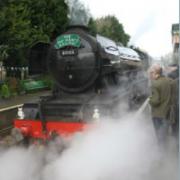 Amid steam, the Flying Scotsman on the Watercress Line