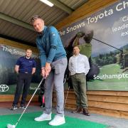 Paultons Golf Centre resident coach and newly-turned pro Lewis Scott (foreground) attempts the Snows Toyota Challenge