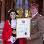 The Mayor of Winchester, Cllr Angela Clear with Col Patrick Allen of the Royal Logistic Corps with the Scroll of the Freedom of Entry to the City
