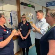 Trust chief executive Alex Whitfield (right), Steve Brine MP and staff at Florence Portal House maternity unit