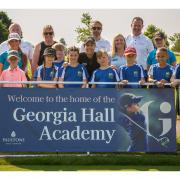 Georgia Hall pictured with school children and teachers from Foxhills Primary School and Paultons Golf Centre team