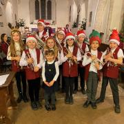 Silver band welcomes Christmas with church Christingle performance