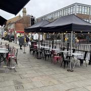 The tables and chairs on the pavement in Jewry Street