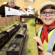 A young model train enthusiast