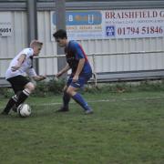 Action from Saturday's match between Romsey Town and New Milton