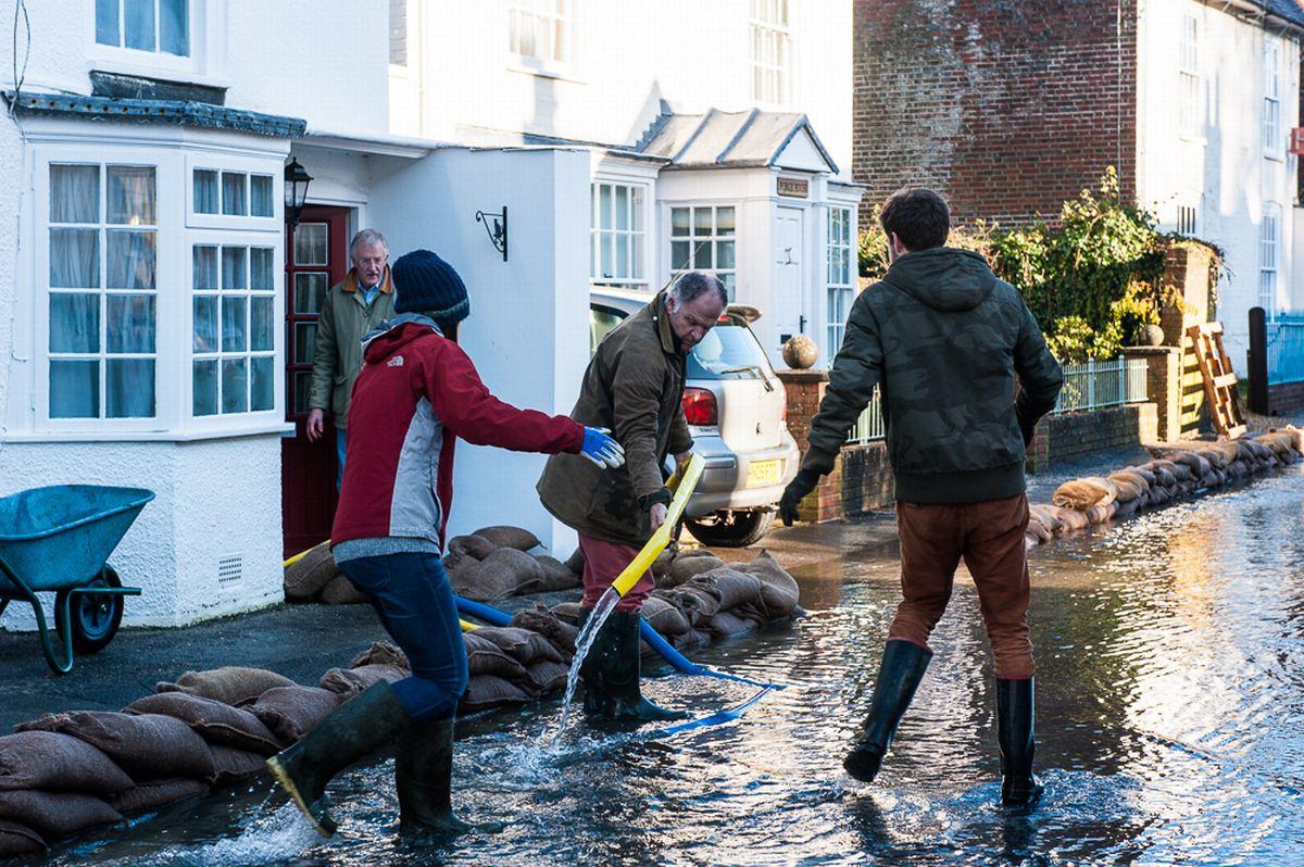 Residents in Hambledon take action against month-long floods. By Chris Dixon.