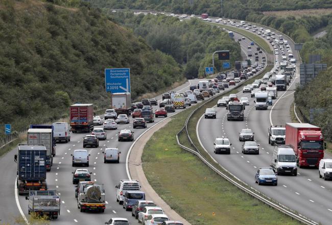 Traffic begins to build on the M3 near to Winchester in Hampshire ahead of the bank holiday weekend. Drivers are being warned to expect delays as more than 14 million cars take to the roads for leisure trips between Thursday and Monday, according to the