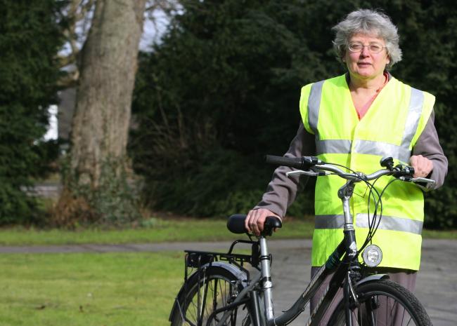 Christine Holloway, pictured outside the Civic Offices, Eastleigh, Southampton, Christine is becoming the co-ordinator of green group Winacc, Christine demonstrates her eco-friendly side by riding to work.