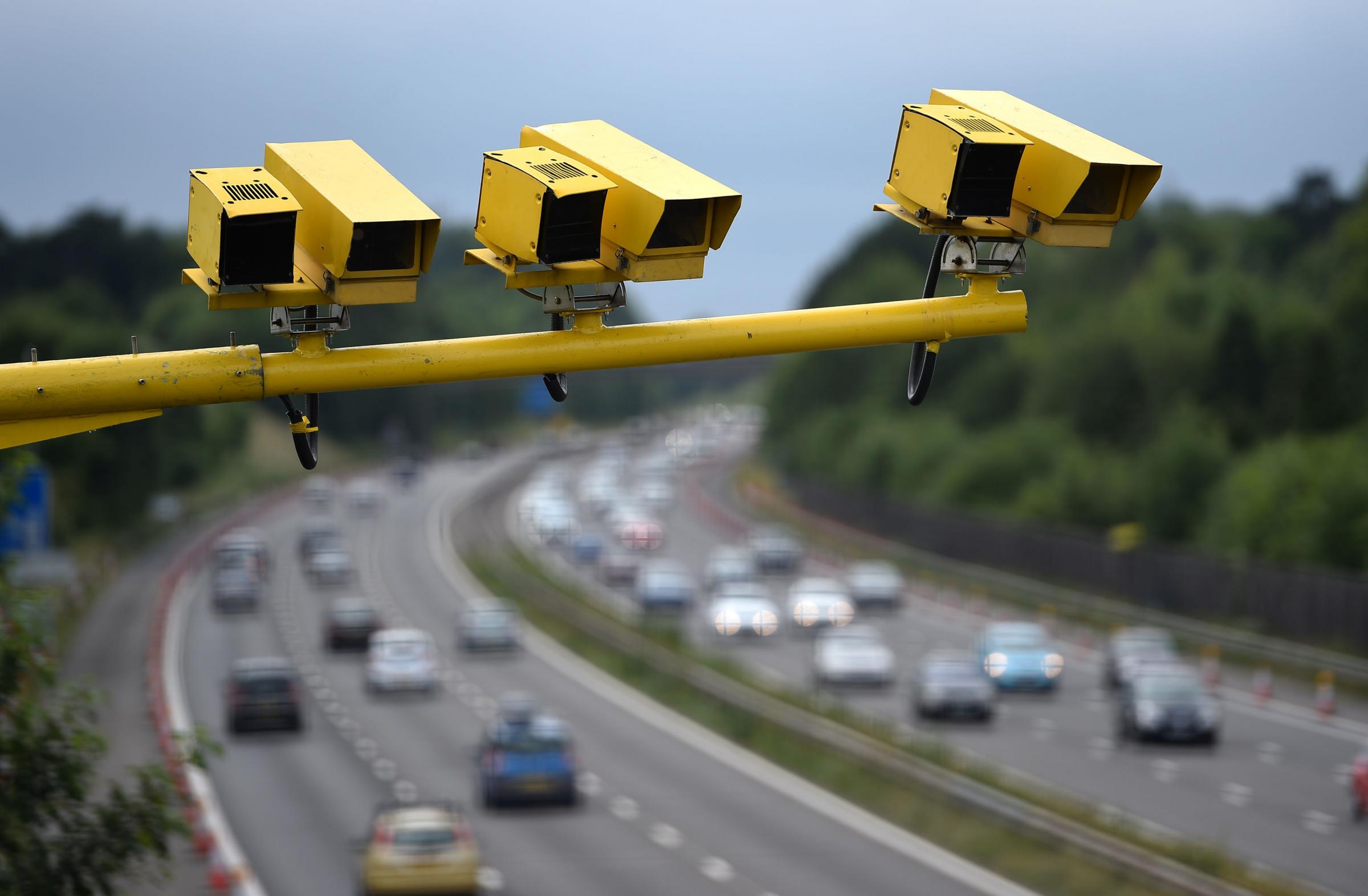 File photo dated 28/06/15 of three SPECS Average Speed cameras in position on the M3 motorway in Hampshire. One in six (18 percent) drivers admits to speeding above 100mph, a new survey suggests..