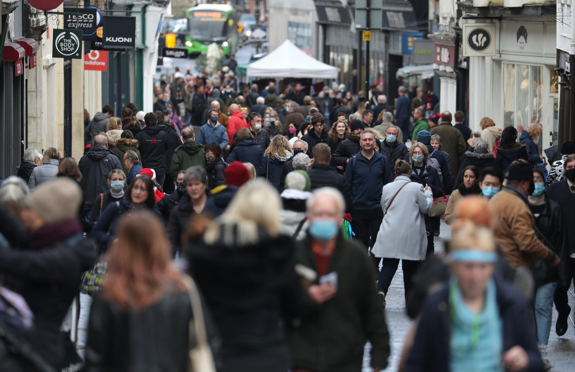 Christmas shoppers make their way along the High street in Winchester, Hampshire, which is in tier 2 of coronavirus restrictions. Downing Street has said that restrictions measures over the Christmas period were being kept under constant review in res