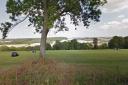 Whitewool Farm: the site is just beyond the woodland in the middle distance. Photo: Google