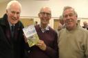 Dr John Lander with his book, centre, with former principal, Dr Len Norman (left) and lecturer John Britton (right)