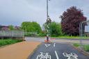 A new cycle path directs cyclists into the path of a Zebra crossing pole.