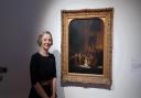 National Gallery head of curation Christine Riding stands with Rembrandt's The Woman taken by Adultery