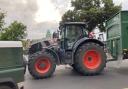 Tractors carrying grass cuttings through Winchester City Centre