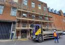Scaffolding goes up to the rear of empty city centre shop