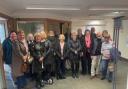 Former staff of Lloyds Bank in Alresford gathering in the branch for the last time