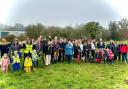 A group photo of the tree planting at the Barley Fields Community Orchard