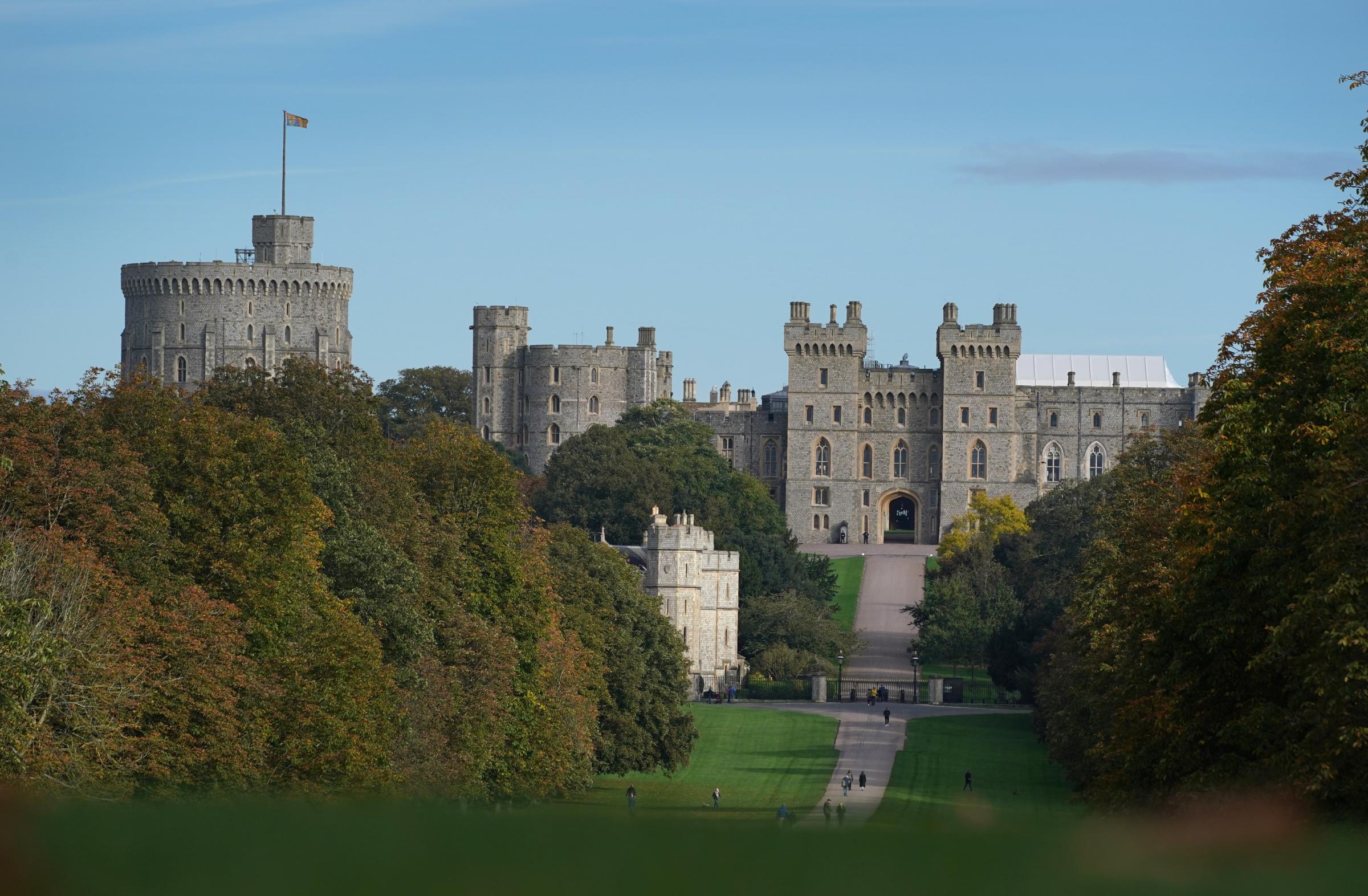 Walkers on the Long Walk in front of Windsor Castle, Berkshire, after Queen Elizabeth II returned there on Thursday after spending a night in hospital for what a Buckingham Palace spokesman described as preliminary investigations. Picture date: