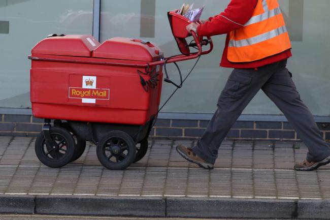 A Royal Mail postal worker