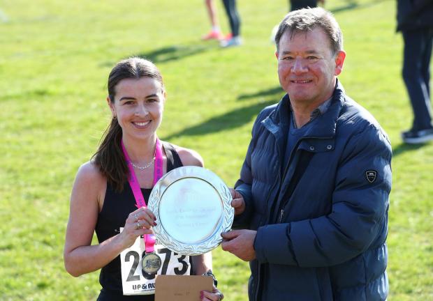 Hampshire Chronicle: Eastleigh 10K 2022 road race. First Woman Sarah Astin presented with her trophy by race organiser Steve Collins. Photo Stuart Martin