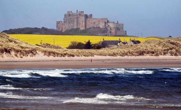 Hampshire Chronicle: Bamburgh has been ranked number one in the Which? seaside destination survey three times. Picture: PA