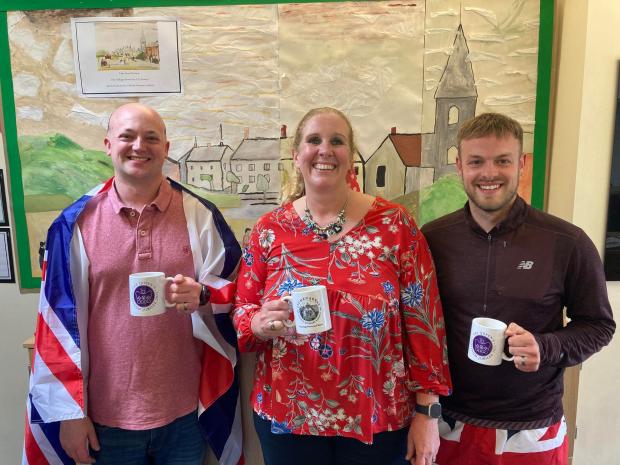 Hampshire Chronicle: Rob Bogan, Aimee Dear and Sam Robbins with the school jubilee mugs