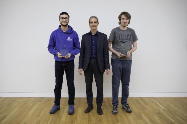 Hampshire Chronicle: Mike Bridgeman, Assistant Director (Economy, Transport and Environment), presents Joshua Steel and David Goulbourne with their Trainee of the Year awards