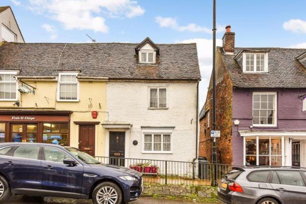 Hampshire Chronicle: This cosy Grade II Listed Georgian cottage is on the market for £450,000 after a price slash from £900,000. Credit: Prado