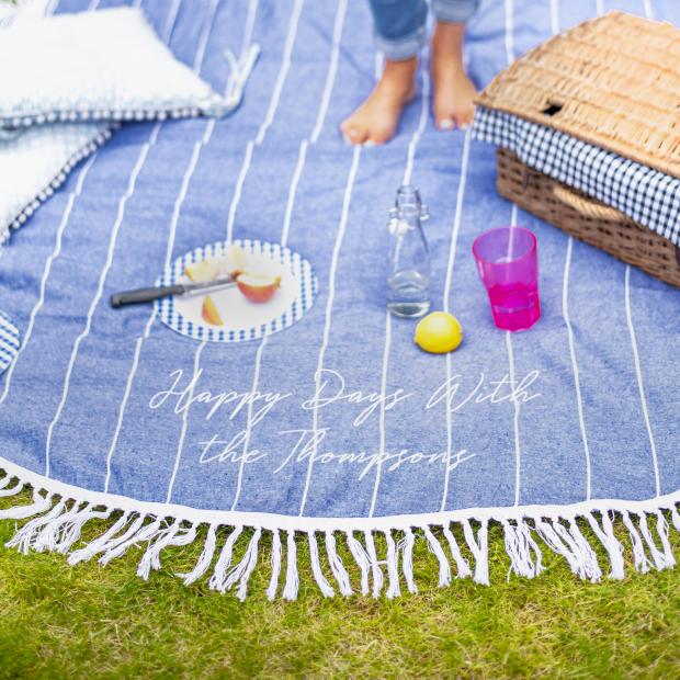 Hampshire Chronicle: Personalised Round Blue Picnic Or Beach Blanket. Credit: Not On The High Street