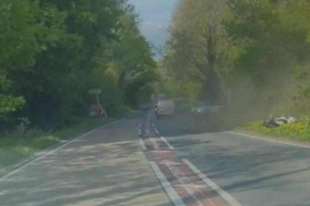 Hampshire Chronicle: A still from footage taken by another driver of a collision between a van driver and a motorcyclist on the A32 near Wickham on April 30