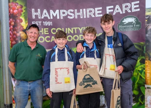 Hampshire Chronicle: Farm Manager David Miller of Wheatsheaf Farming with one of the winning teams - Farm my Food 2022, photo: The Electric Eye Photography