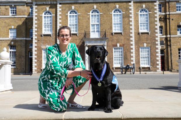 Hampshire Chronicle: Dr Liz Spruin and Oliver wearing his PDSA Order of Merit (PDSA)