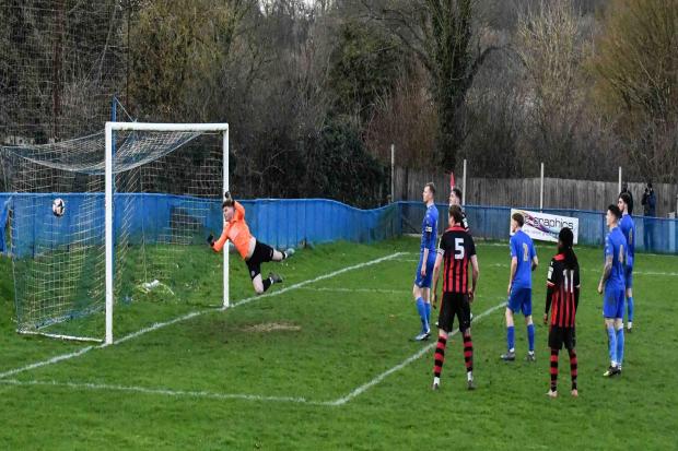 Romsey's third goal hits the back of the net