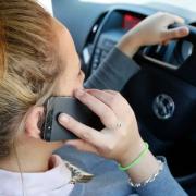 Mobile phone at the wheel. Stock image