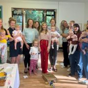 Eco Montessori nursery kids, mums and staff with children's cookery author Annabel Karmel (centre)