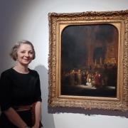 National Gallery head of curation Christine Riding stands with Rembrandt's The Woman taken by Adultery