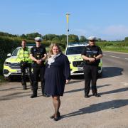 PCC Donna Jones in front of one of the new average speed cameras and officers in the Roads Policing Unit on the A32 West Meon. From left: Inspector Andy Tester and PC Owen Athersuch, PCC Donna Jones, PC Aaron Bendall