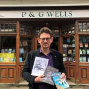 Steve Scholey of P&G Wells holding the shop's bestsellers