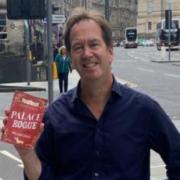 Bill Coles with a copy of Palace Rogue