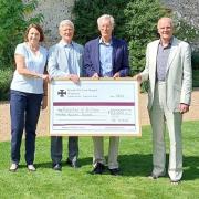 The Hospital Chairman and Treasurer receive a cheque from the Chairman and Treasurer of the Friends