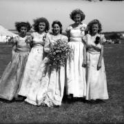 Carnival Queen and attendants at a windy Winnall fete at Bar End in 1948