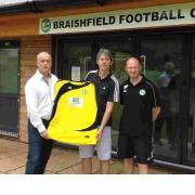 GETTING SHIRTY: Ace-Liftaway’s Philip Liddell  presents a new strip to Braishfield chairman Kevin Hitchcock and first team manager Matthew Payne.