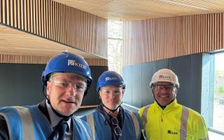 Steve Brine MP with members of the Winchester College and construction team during the visit